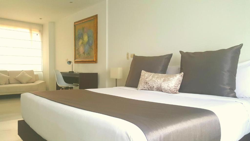 Postel nebo postele na pokoji v ubytování Suites 109 GH Usaquén
