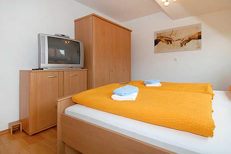Postel nebo postele na pokoji v ubytování Haus Benser Riff