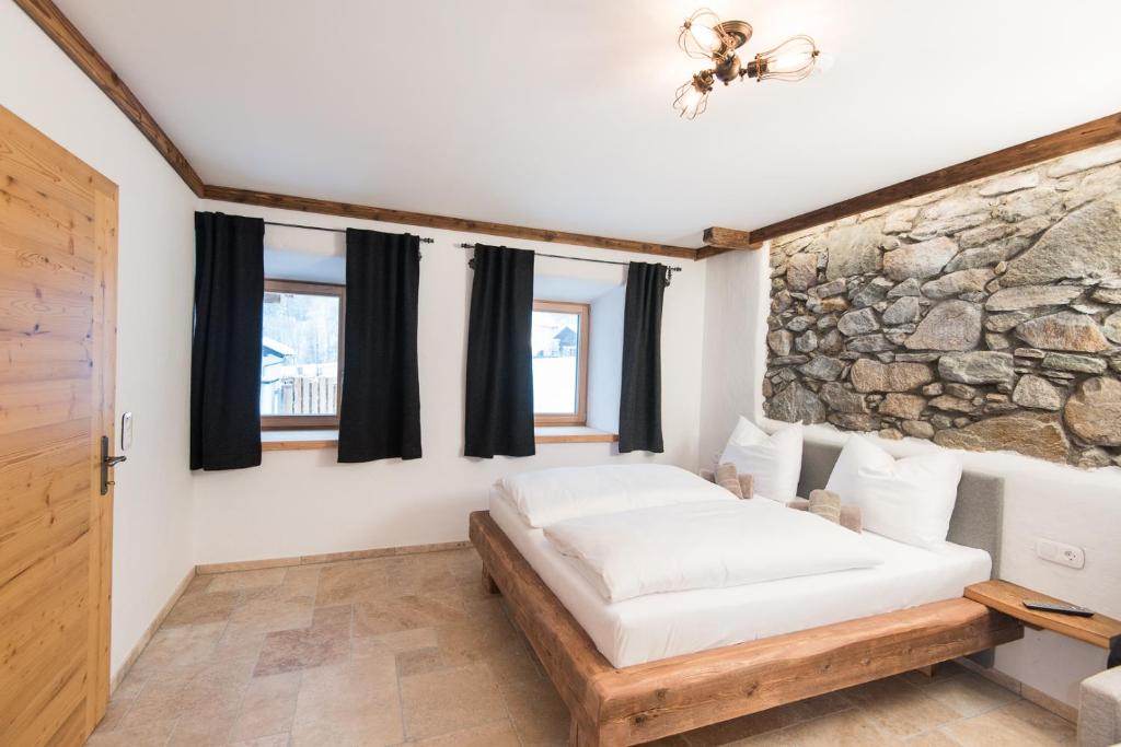 Postel nebo postele na pokoji v ubytování Gletscher Appartements
