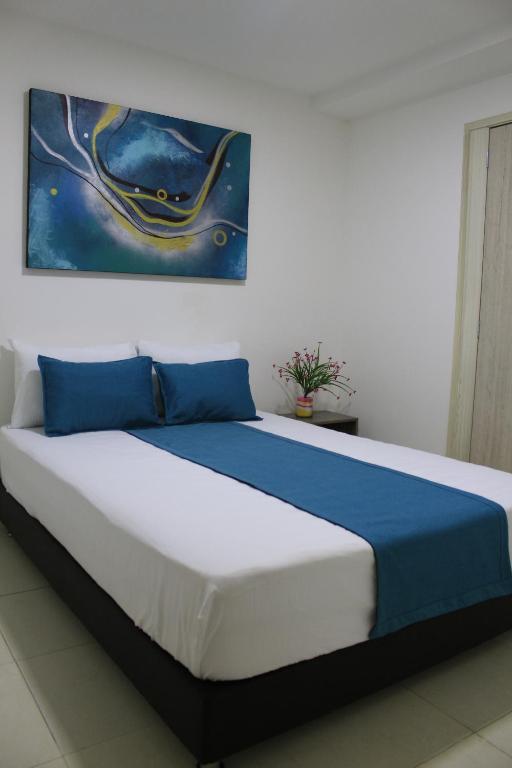 Postel nebo postele na pokoji v ubytování Hotel Pereira 421