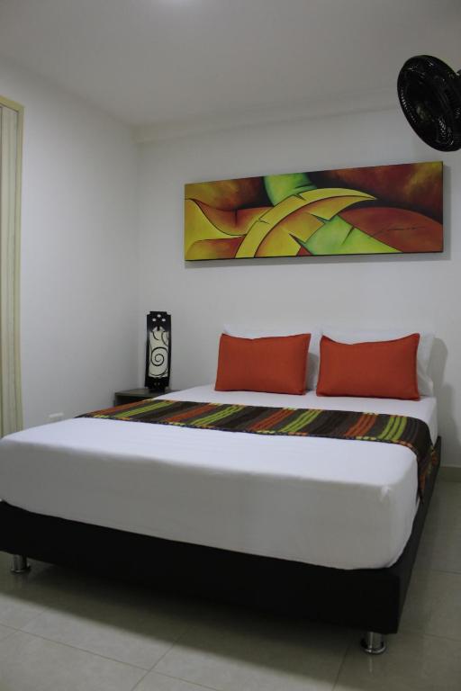 Postel nebo postele na pokoji v ubytování Hotel Pereira 421