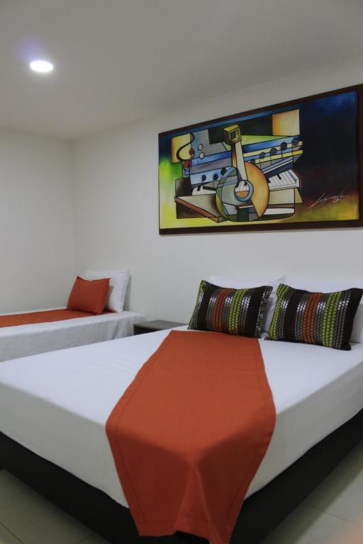 Postel nebo postele na pokoji v ubytování Hotel Pereira 421
