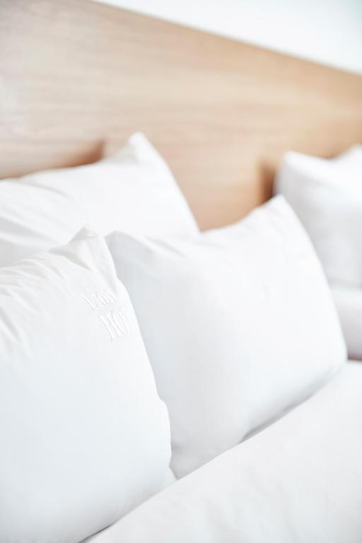 Postel nebo postele na pokoji v ubytování Lion Hotel