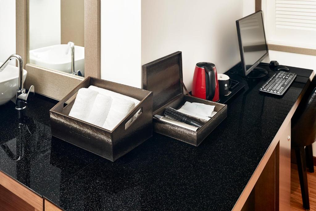 TV a/nebo společenská místnost v ubytování Lion Hotel