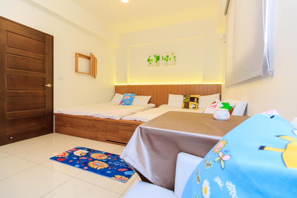 Postel nebo postele na pokoji v ubytování Yilan Dongshan Cypress B&B