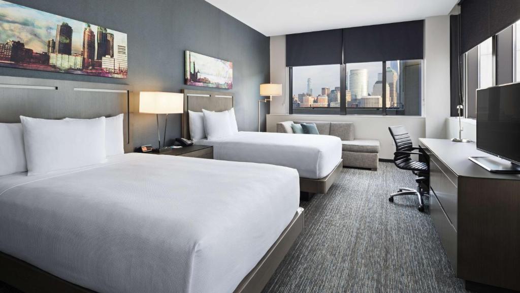 Postel nebo postele na pokoji v ubytování Hyatt House Jersey City