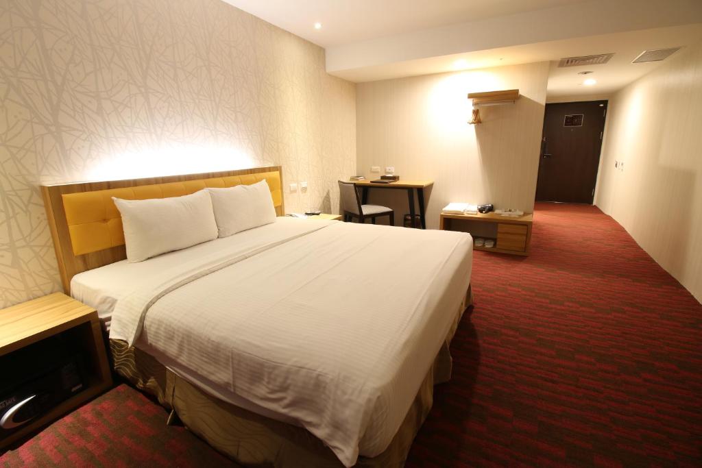 Postel nebo postele na pokoji v ubytování Bamboo Hotel