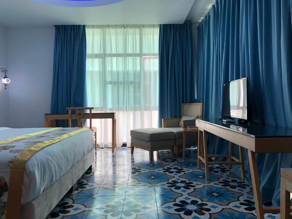 Postel nebo postele na pokoji v ubytování Hotel Hilal