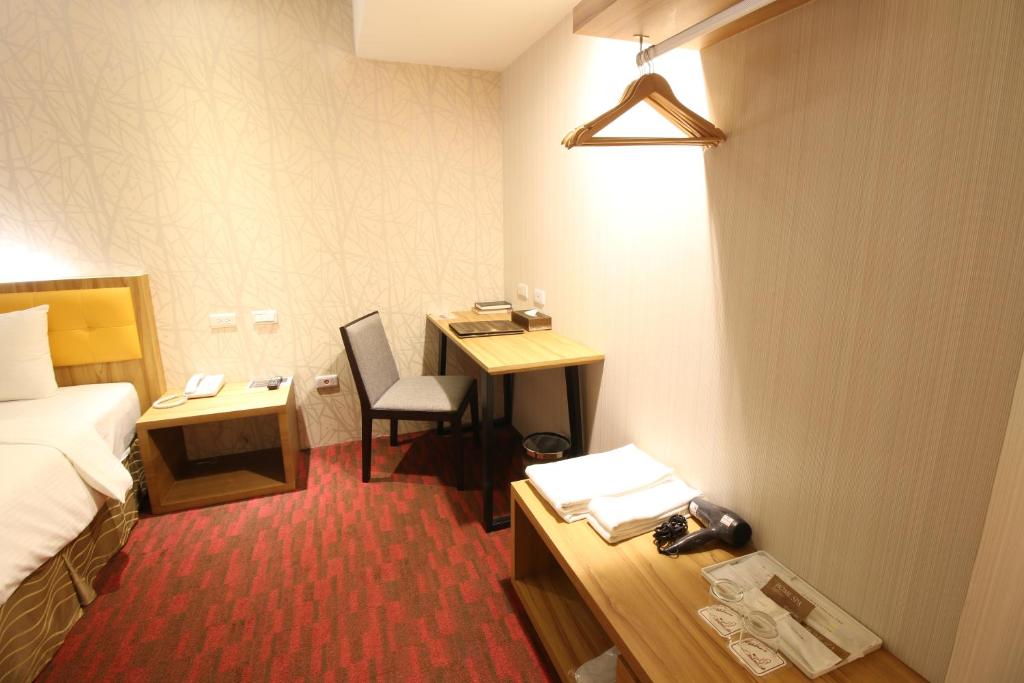 Postel nebo postele na pokoji v ubytování Bamboo Hotel