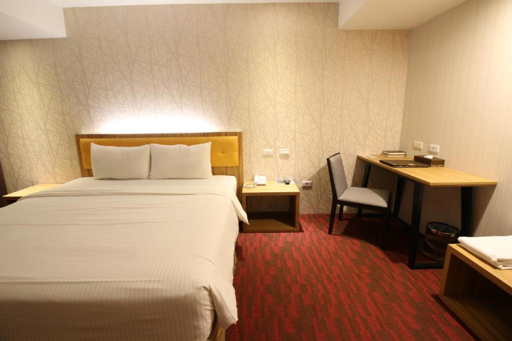 Postel nebo postele na pokoji v ubytování Bamboo Hotel