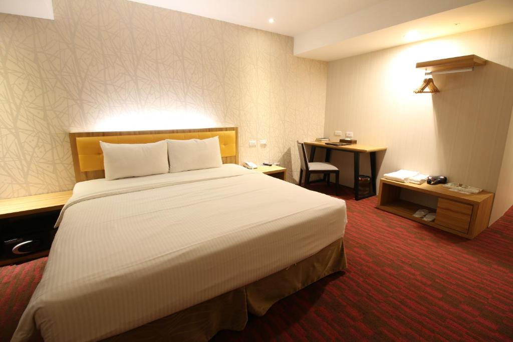 Postel nebo postele na pokoji v ubytování Bamboo Hotel