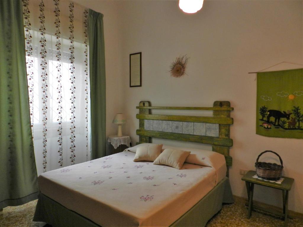 Ένα ή περισσότερα κρεβάτια σε δωμάτιο στο Casa Corte con Terrazza