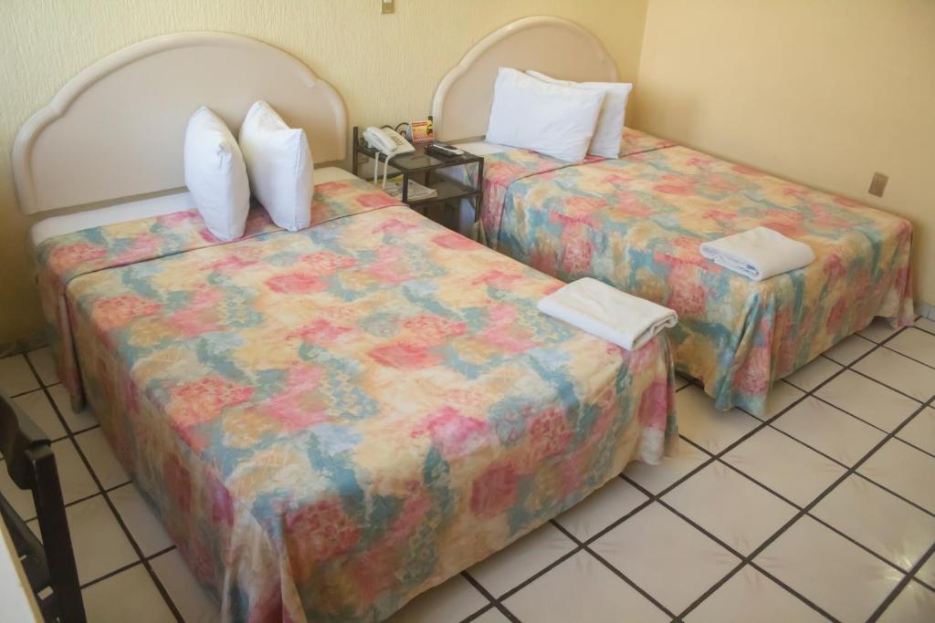 Postel nebo postele na pokoji v ubytování Hotel Terrasol