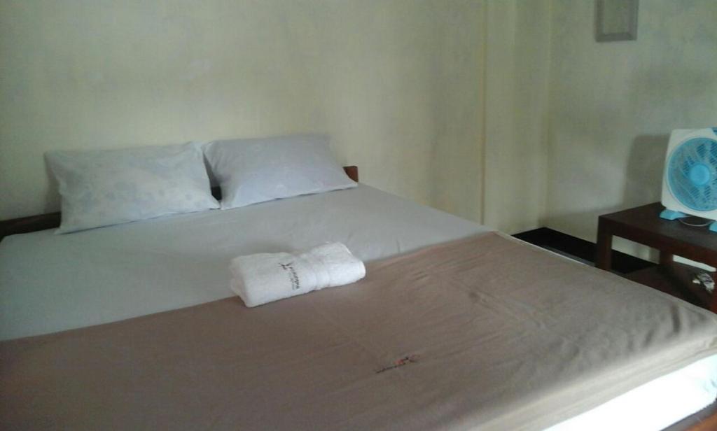 Postel nebo postele na pokoji v ubytování Pedek Homestay