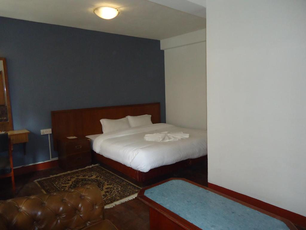 Postel nebo postele na pokoji v ubytování Hotel Earth House