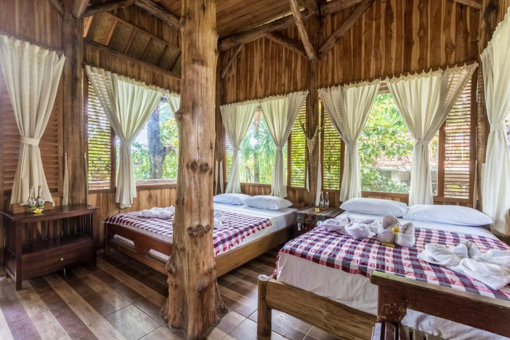 Postel nebo postele na pokoji v ubytování Omunity Bali