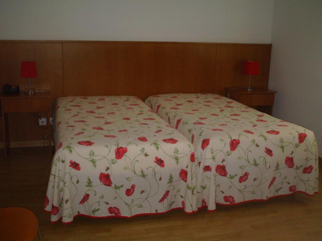 Postel nebo postele na pokoji v ubytování Hotel Serafim
