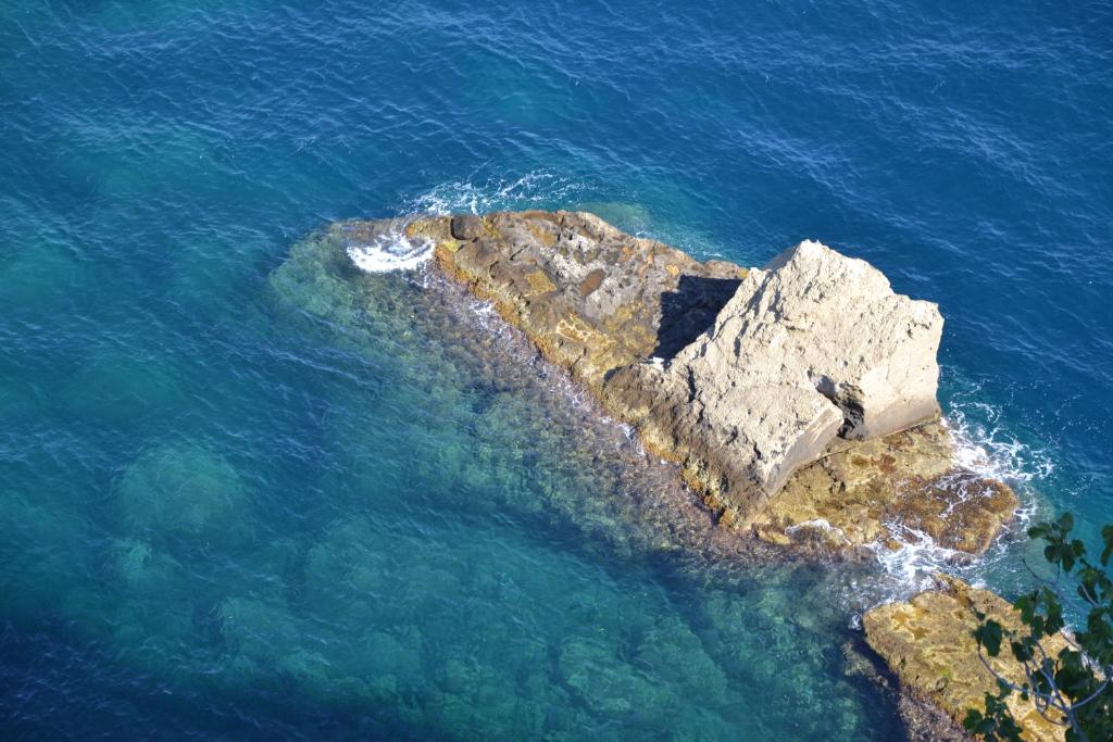 an aerial view of a rock island in the ocean at Terra Murata Boutique b&b in Procida