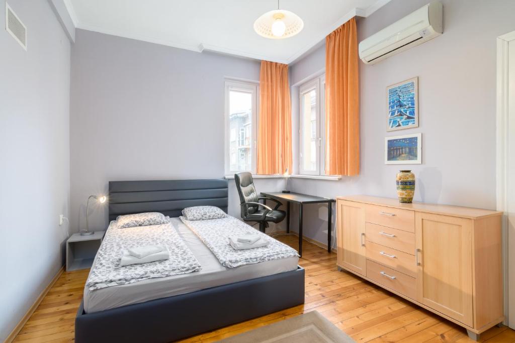 Ένα ή περισσότερα κρεβάτια σε δωμάτιο στο Beautiful Business Apartment- TOP CENTER