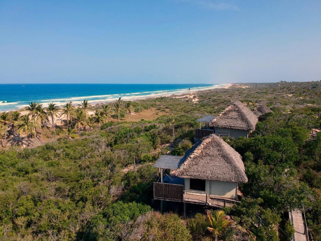 an aerial view of a resort with the beach at Travessia Beach Lodge in Inhambane
