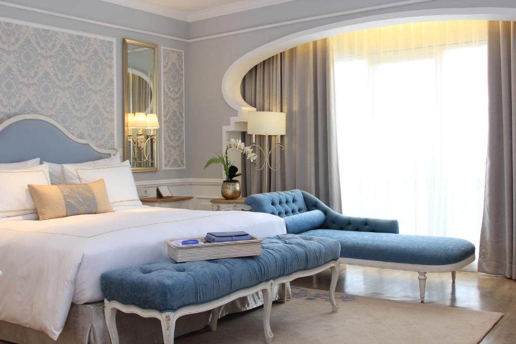 Postel nebo postele na pokoji v ubytování Noor Hotel