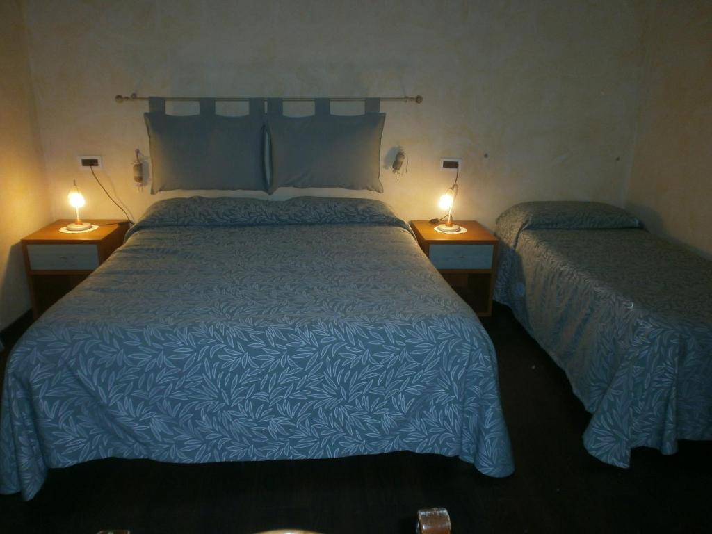 Postel nebo postele na pokoji v ubytování Albergo Vecchio Pavone