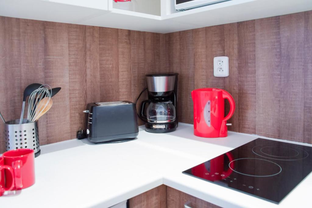 Kuchyňa alebo kuchynka v ubytovaní Modern Apartments Opatovická