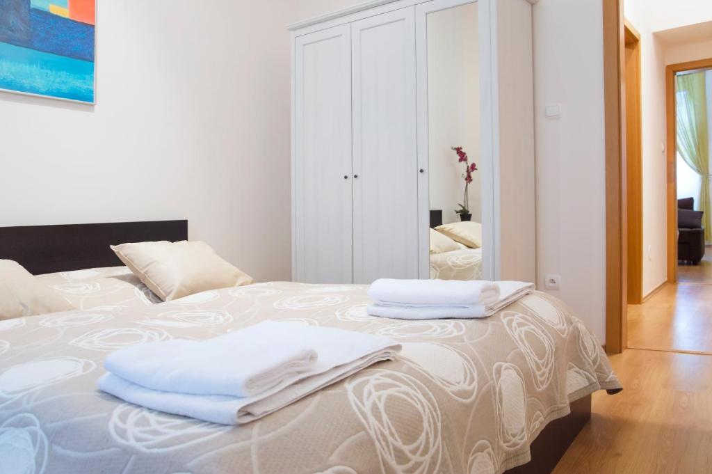 Posteľ alebo postele v izbe v ubytovaní Modern Apartments Opatovická