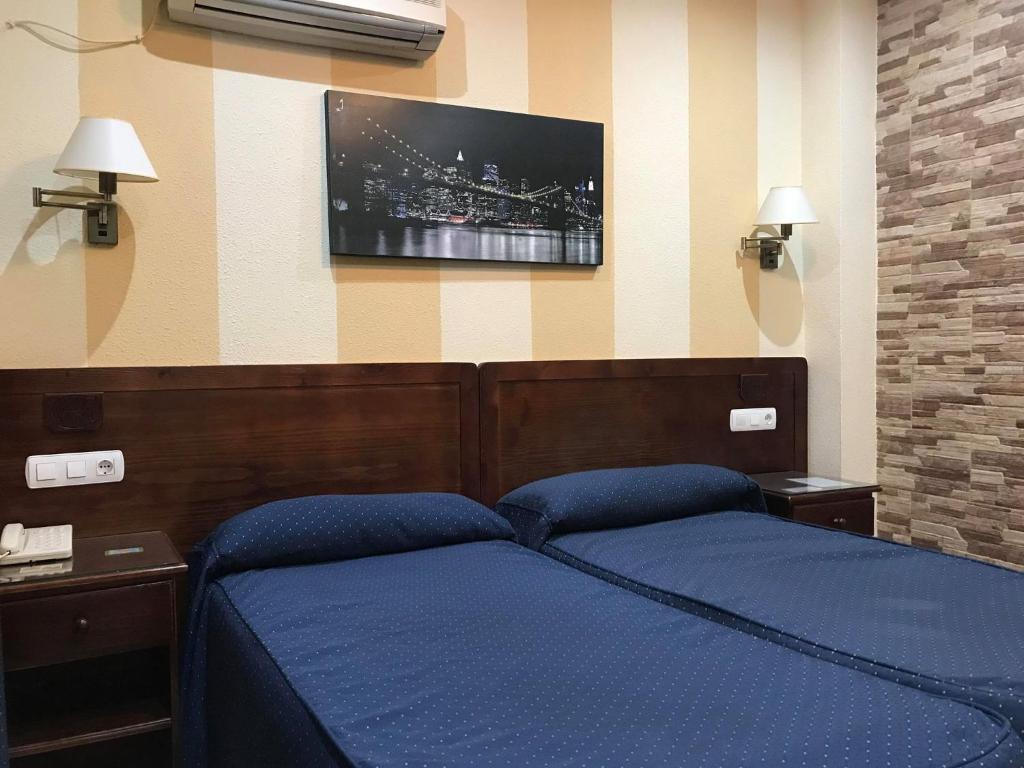 Postel nebo postele na pokoji v ubytování Hotel Nova Centro