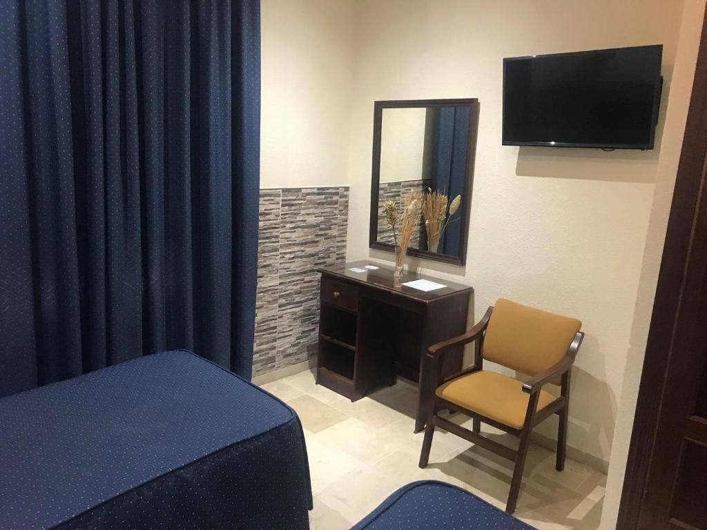 TV a/nebo společenská místnost v ubytování Hotel Nova Centro