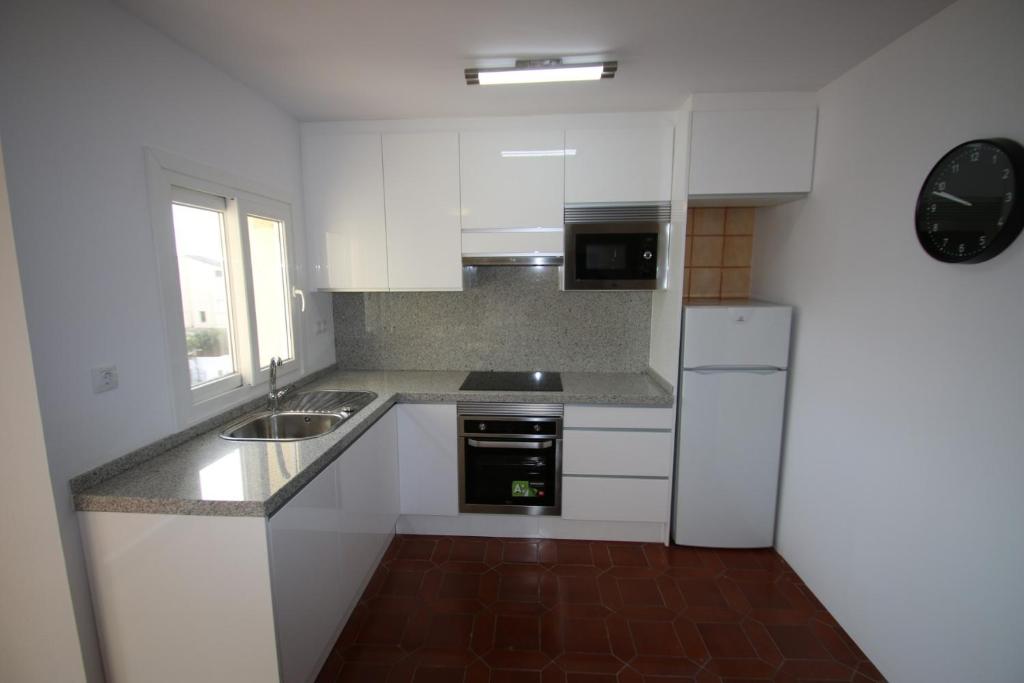 Kuchyň nebo kuchyňský kout v ubytování Apartamento Leo