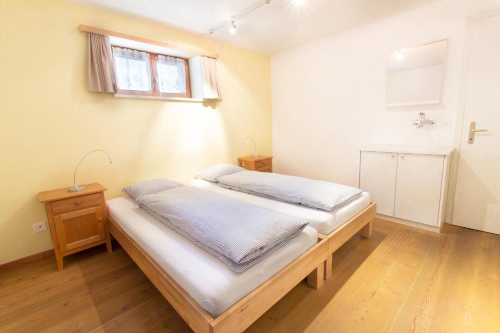 Postel nebo postele na pokoji v ubytování Apartment Dorfblick