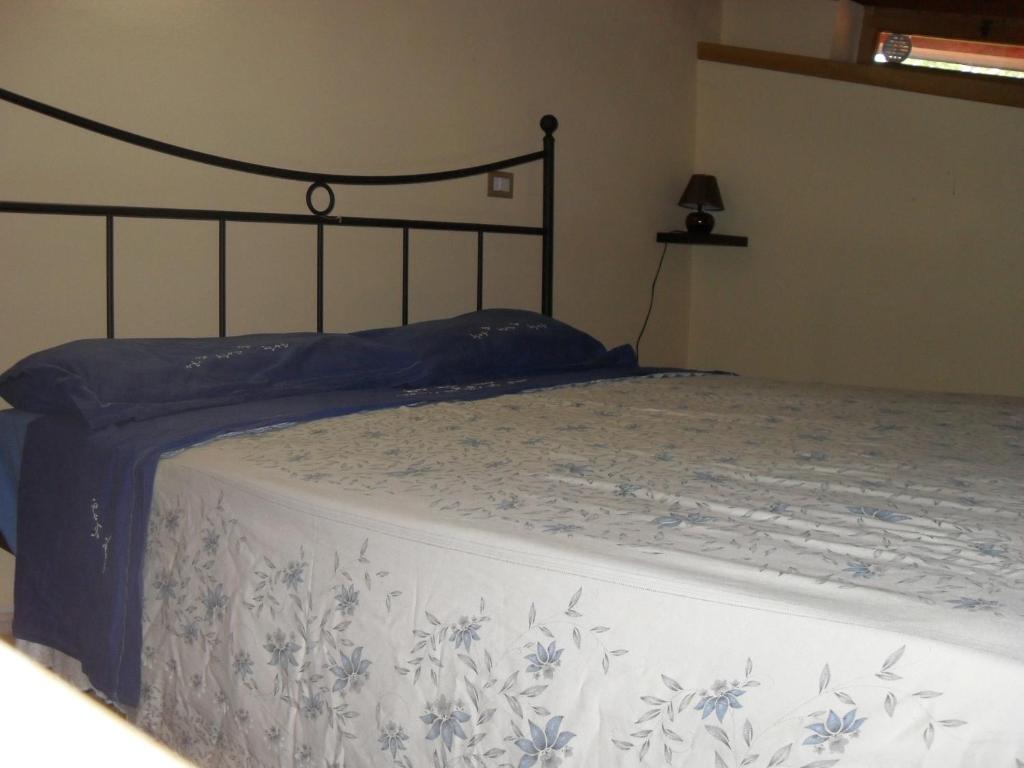 Letto o letti in una camera di Agriturismo Pietro Falcone