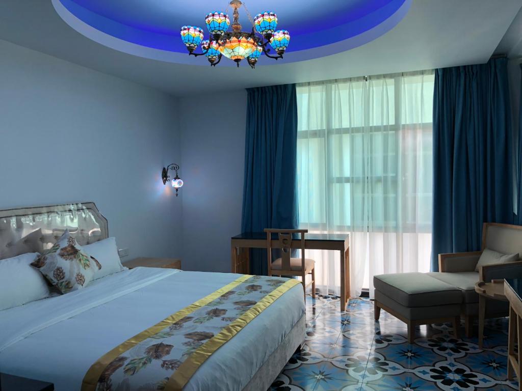 Postel nebo postele na pokoji v ubytování Hotel Hilal