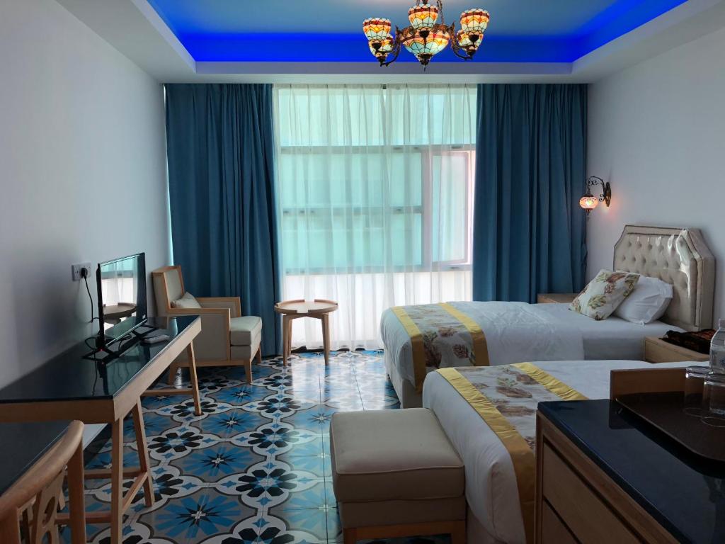 Postel nebo postele na pokoji v ubytování Hotel Hilal