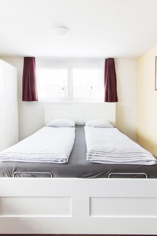 Postel nebo postele na pokoji v ubytování Apartment Dorfblick