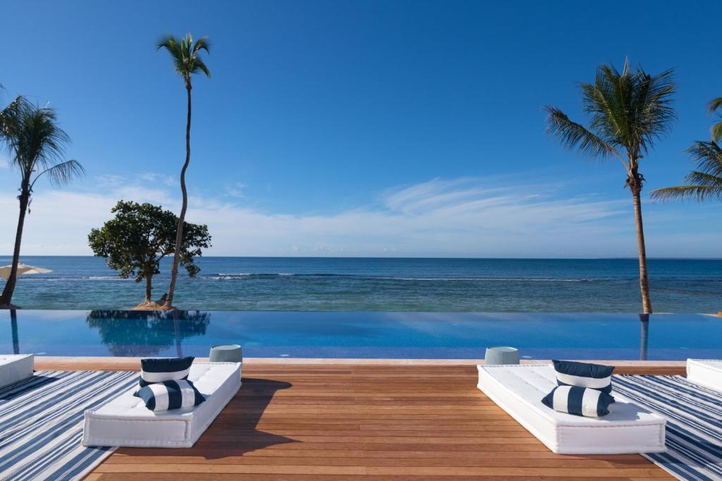 a view of the ocean from a resort swimming pool at Casa de Campo Resort & Villas in La Romana