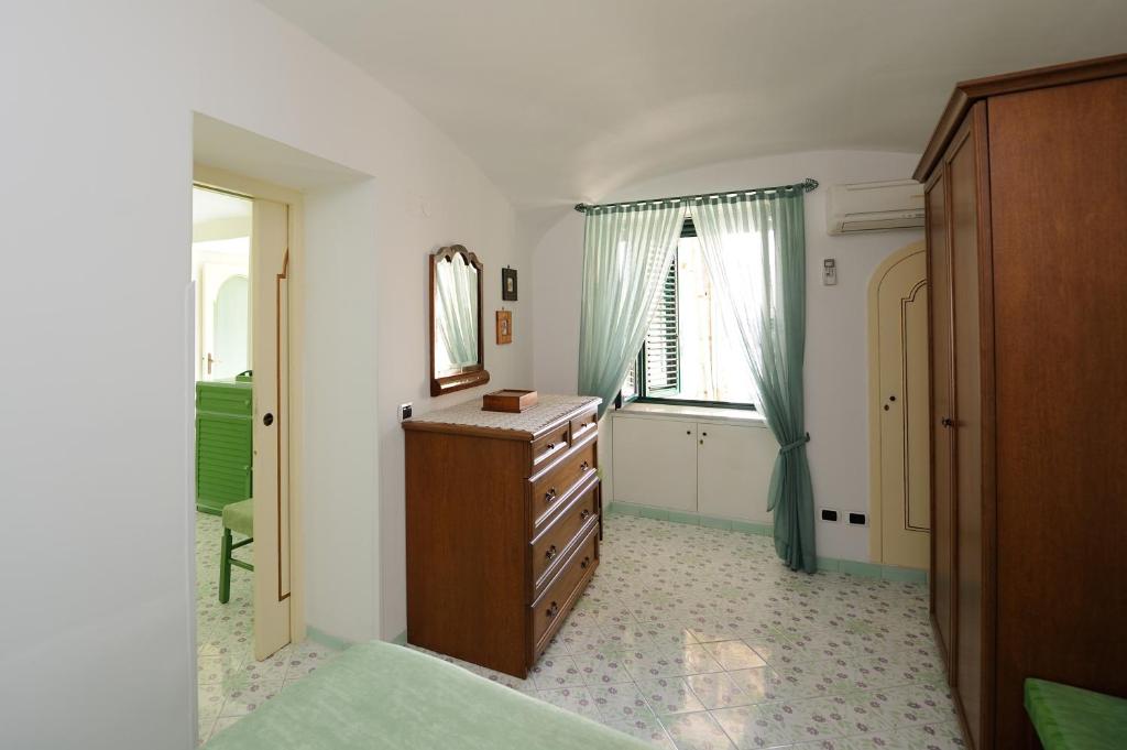 A bed or beds in a room at That's Atrani, Amalfi Coast beach front apartment
