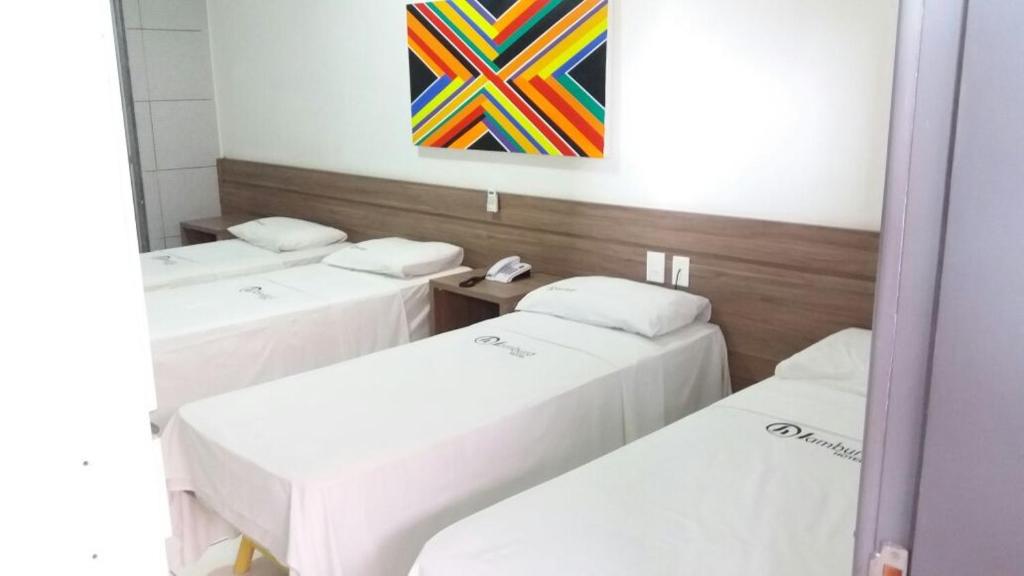 Postel nebo postele na pokoji v ubytování Sambura Hotel