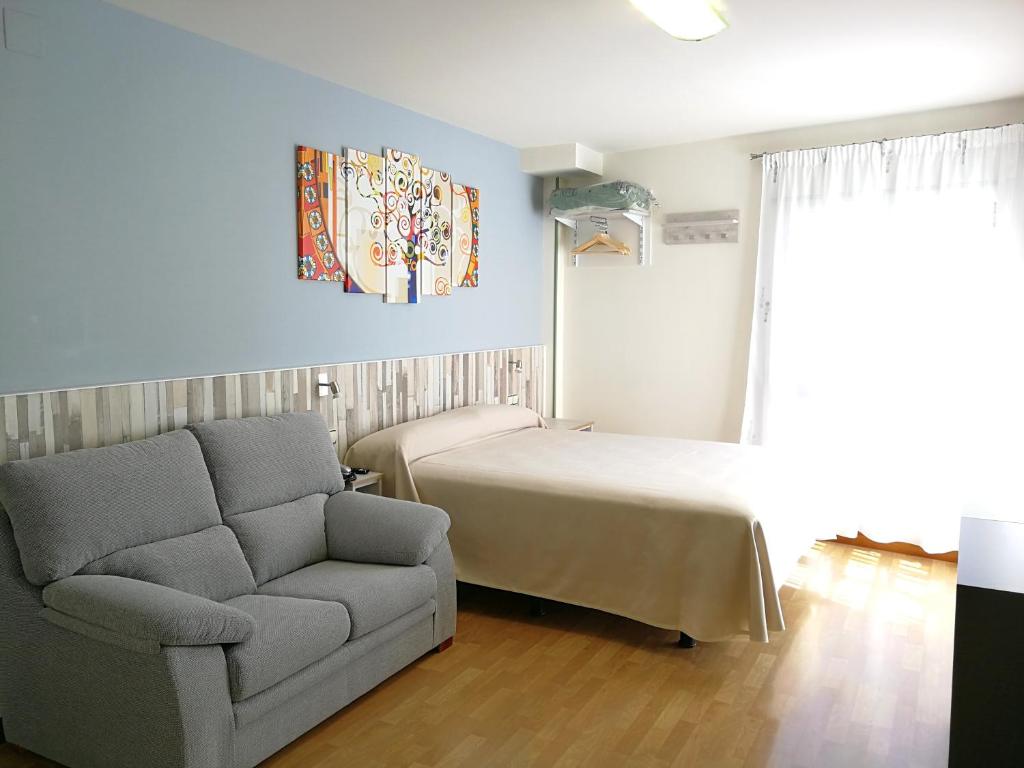 Posteľ alebo postele v izbe v ubytovaní Hotel Apartamentos Aralso