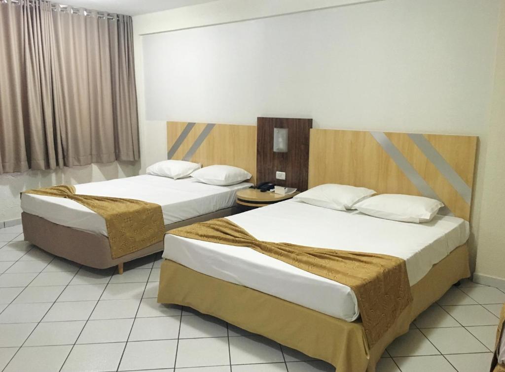 Postel nebo postele na pokoji v ubytování King Konfort Hotel