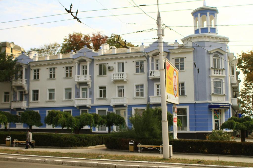a large white building with a tower on top at Old Tiraspol Hostel in Tiraspol