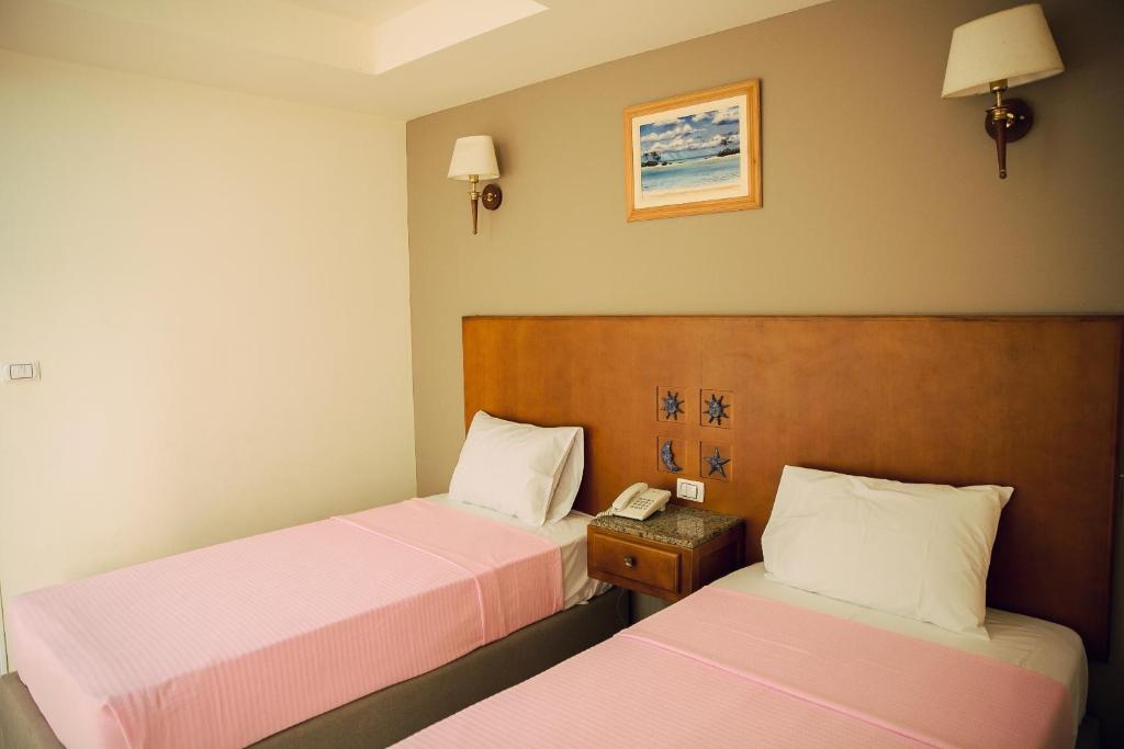 Postel nebo postele na pokoji v ubytování Florida Hotel North Coast