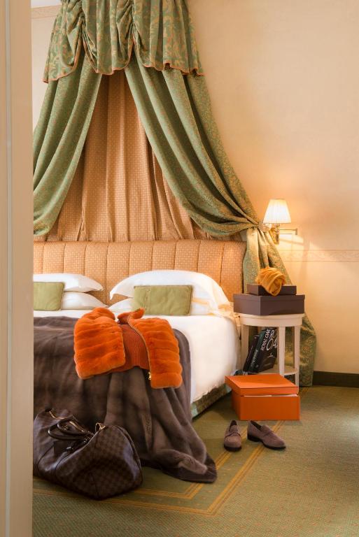 Cama ou camas em um quarto em Grand Hotel Royal E Golf