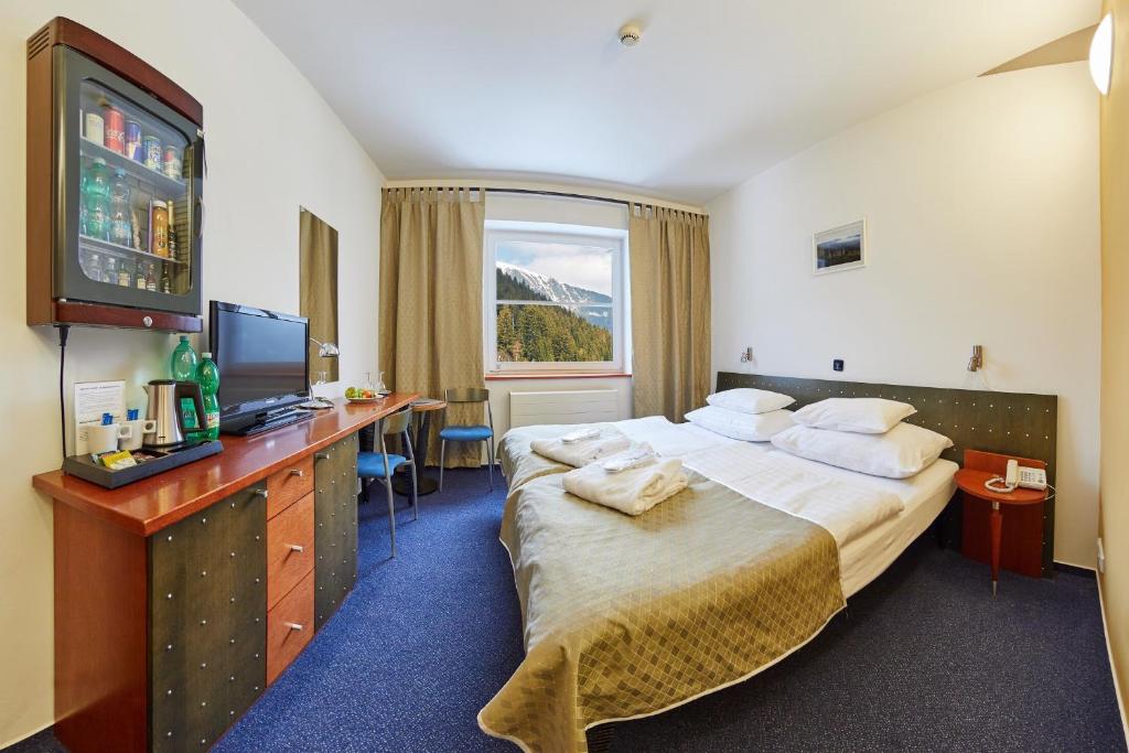 Postel nebo postele na pokoji v ubytování Hotel Horizont