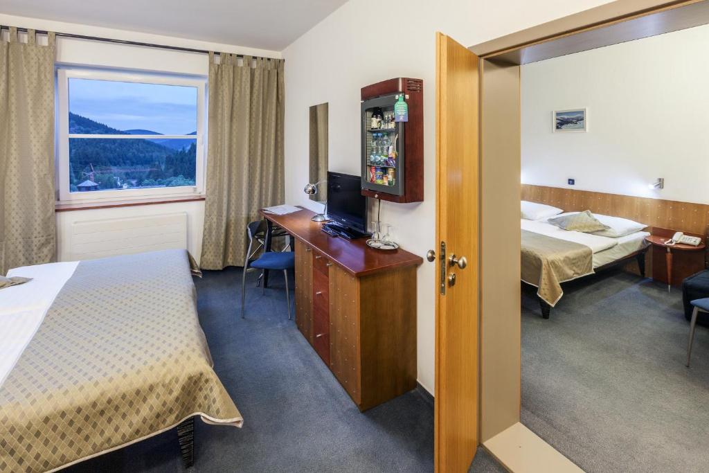 Postel nebo postele na pokoji v ubytování Hotel Horizont
