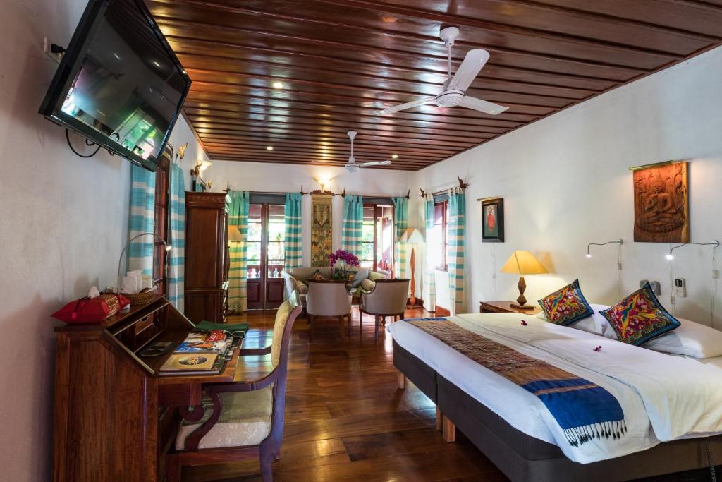 Superior Suite Sideview room layout with comfortable sitting furniture and king bed