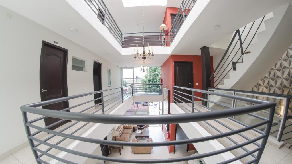 a view of a spiral staircase in a building at Hotel Belisario INN in Guadalajara