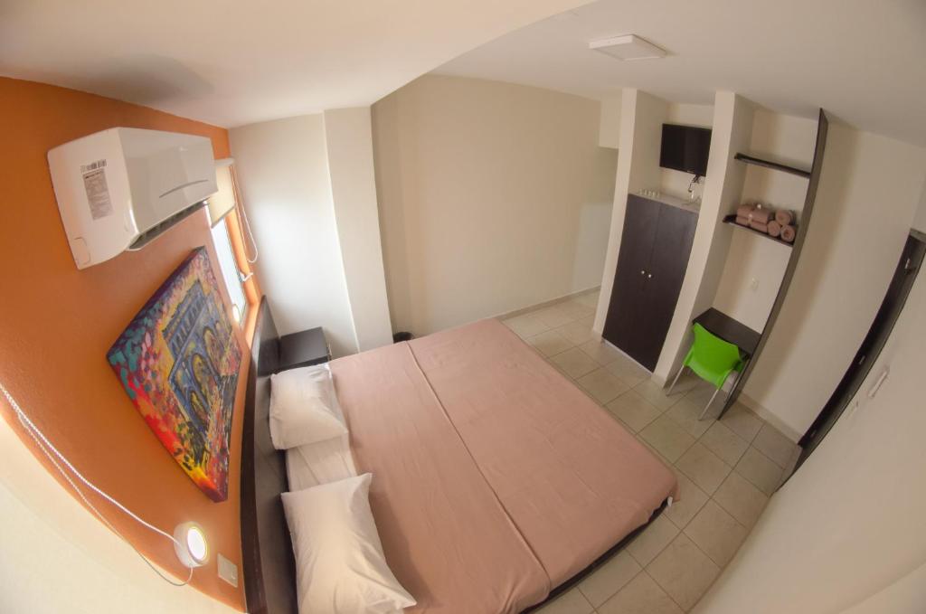 Postel nebo postele na pokoji v ubytování Hotel Belisario INN