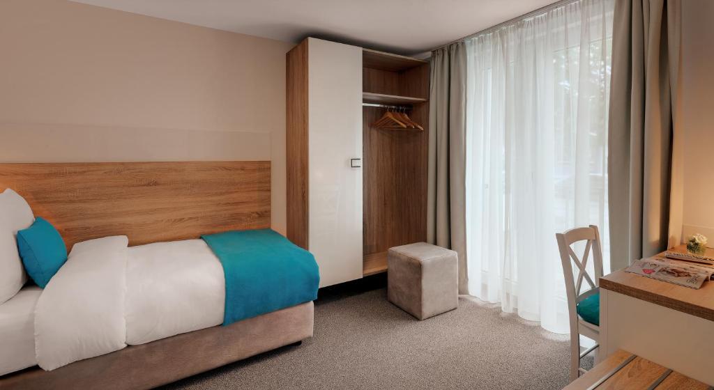 Postel nebo postele na pokoji v ubytování Hotel und Pension Seereich